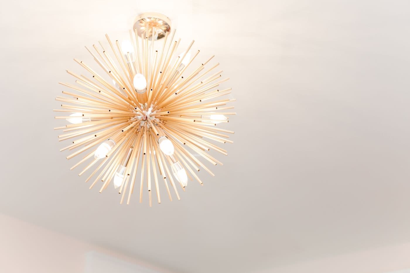 Modern starburst chandelier with glowing bulbs